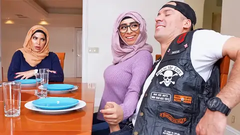 Hijab-wearing doll giving a palm-job from under the table