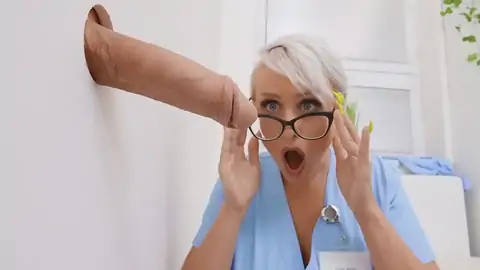 The ash-blonde nurse observes a meaty firm-on at the glory hole