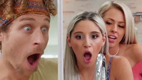 A man and two blondes are hiding from another lad