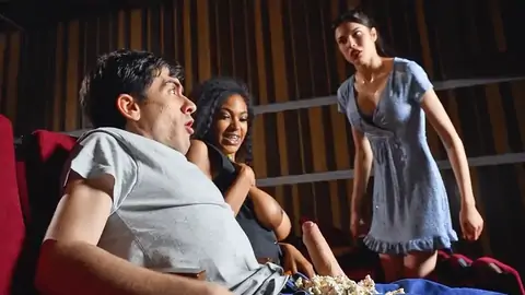 Public bi-racial in the cinema with an ebony