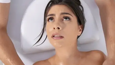 Oiled up black-haired is getting her pussy finger-tickled